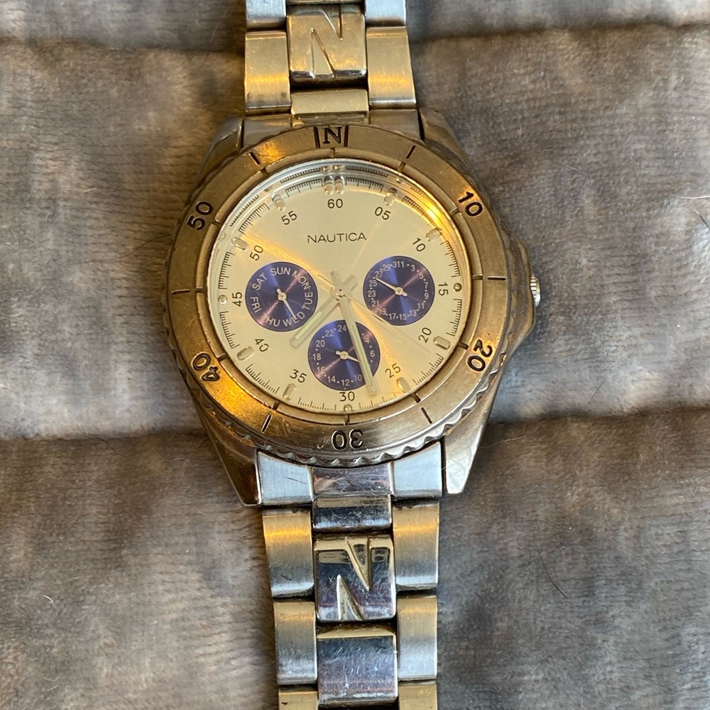 Nautica silver and blue watch with mini dials, used condition.